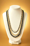 Irene luxurious black and gold four tier necklace