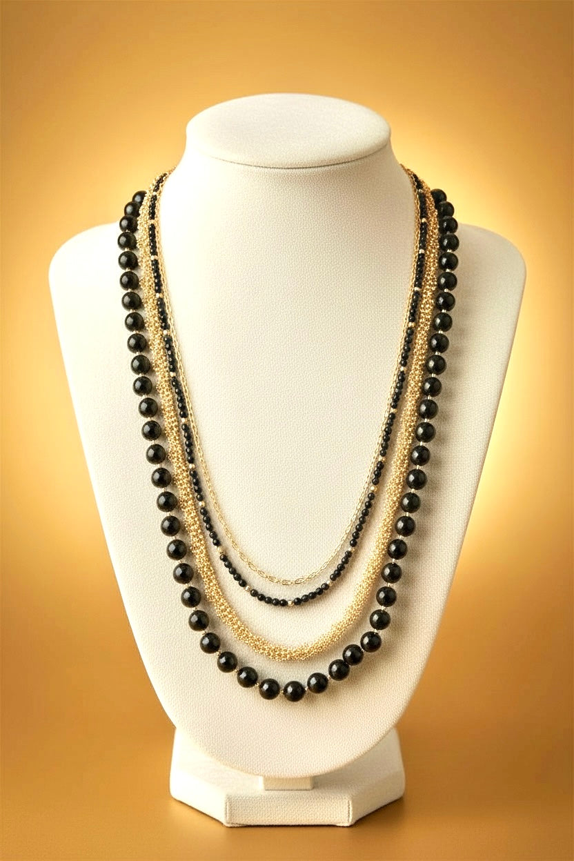Irene luxurious black and gold four tier necklace