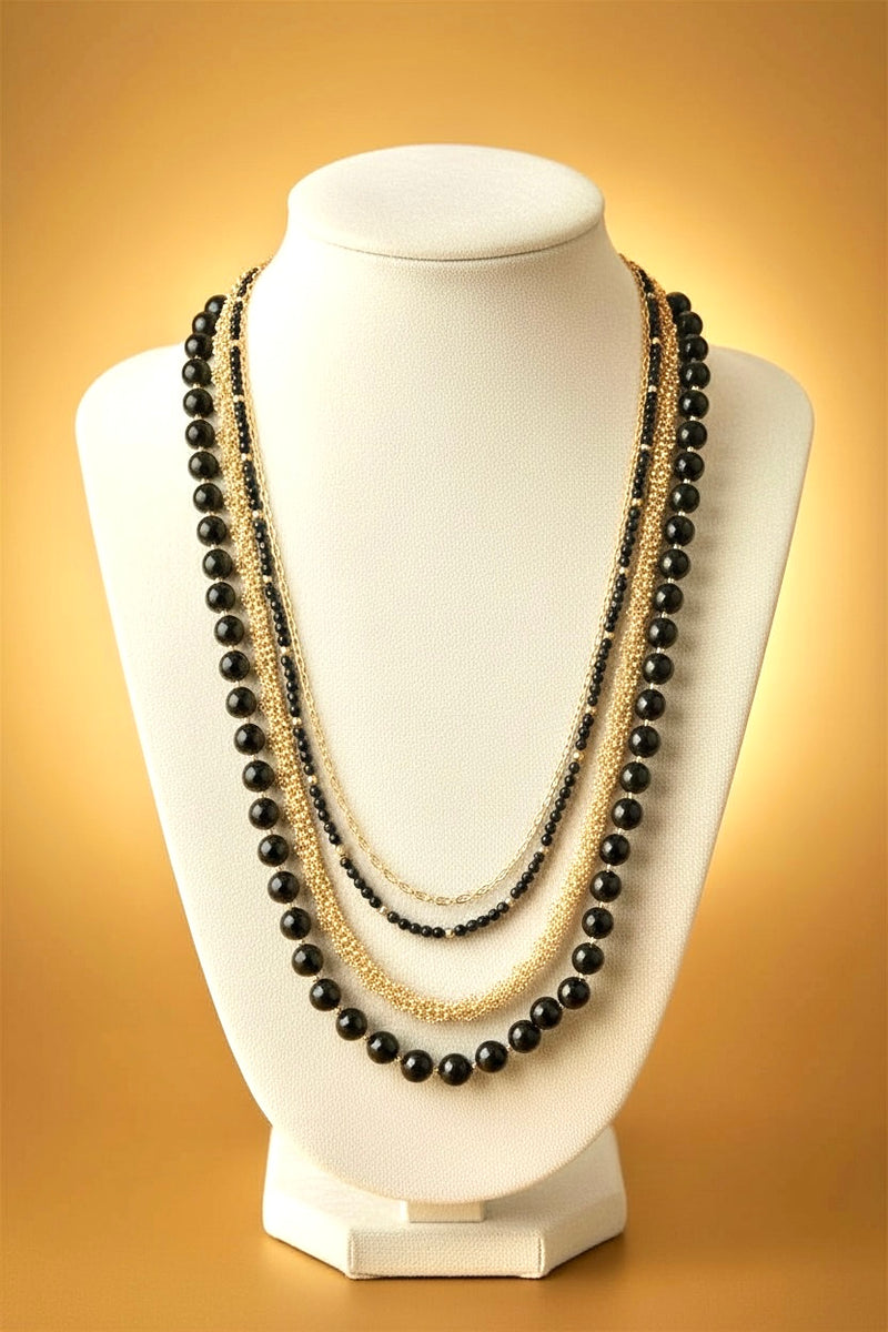 Irene luxurious black and gold four tier necklace