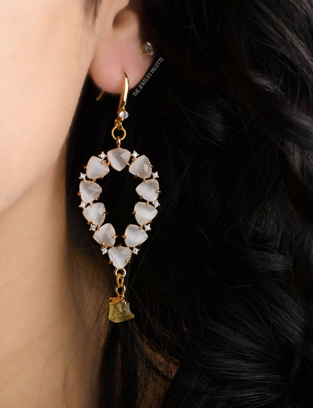 Yara white stones with gold edged emerald drop earrings