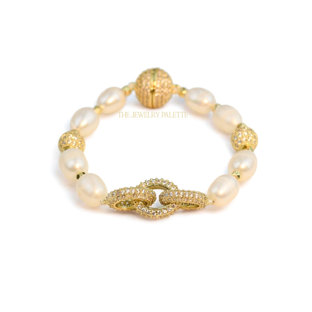 Adele white freshwater pearl bracelet with interlocking gold centerpiece