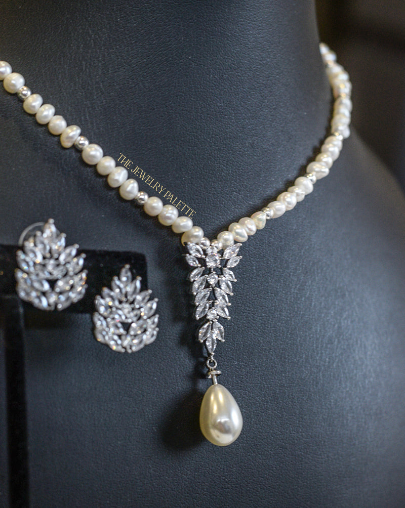 Safa white freshwater pearl earrings and necklace