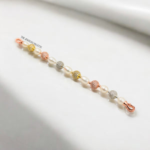 Fleur white freshwater pearl bracelet with gold, silver and rose gold accents