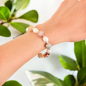 Fleur white freshwater pearl bracelet with gold, silver and rose gold accents