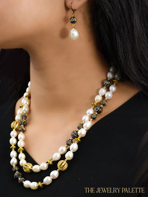 Lunara white freshwater pearl and glittering black stone earrings - The Jewelry Palette
